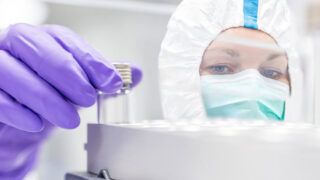 Technician checking stem cell culture