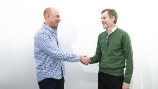 Patrik Eschricht and Peter Egelberg shaking hands