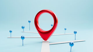 A red pin on a blue map.